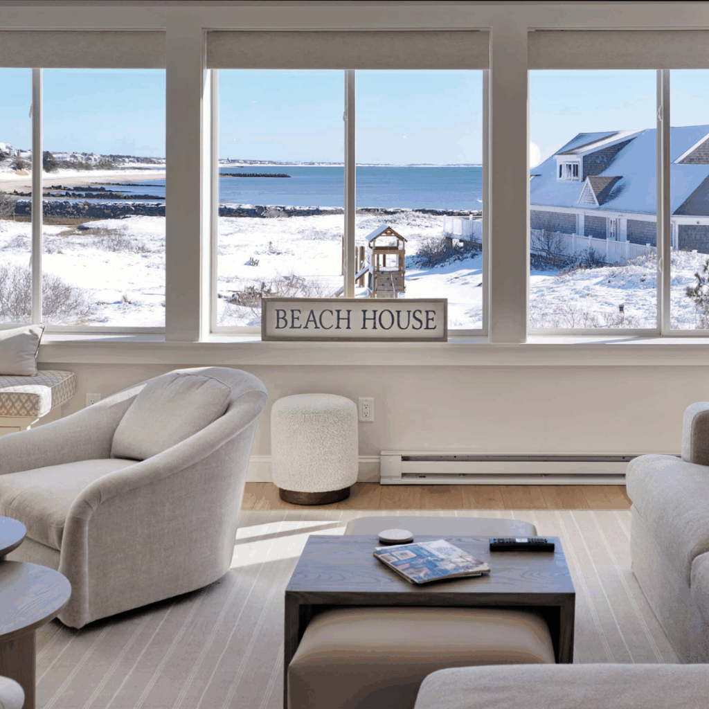 Flexible interior layout in a Cape Cod home featuring open living space with defined seating areas